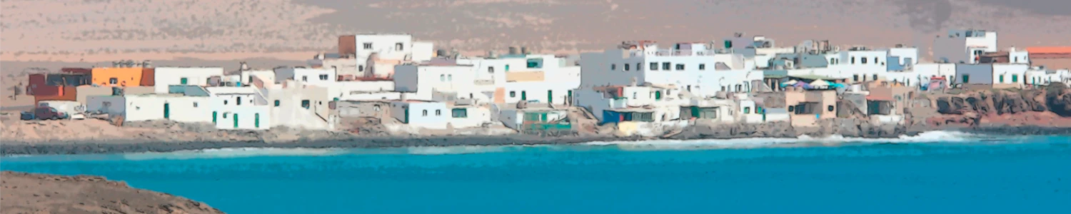 a small fishing village with white painted houses in a remote part of the island of fuerteventure in the canary islands